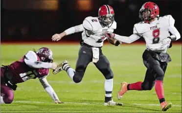  ?? SEAN D. ELLIOT/THE DAY ?? Fitch’s Tyler Nelli (2) follows the lead blocking of Hamear Stephens (8) for a big gain durnig a game against East Lyme last season. Nelli and Stephens return to lead the Falcons, who went 10-0 in 2017, won the ECC Division I title, and qualified for the Class L football playoffs.