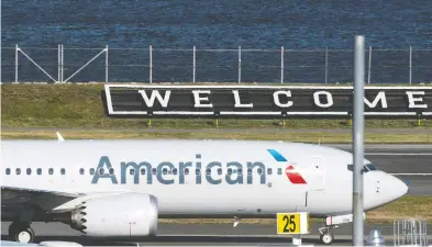  ?? EDUARDO MUNOZ / REUTERS ?? American Airlines flight 718 — the first U.S. Boeing 737 Max commercial flight since regulators lifted a 20-month
grounding in November — lands Tuesday at LaGuardia airport in New York.