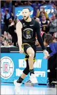  ?? ?? Golden State Warriors guard Stephen Curry (30) celebrates after making a 3-point basket in front of Phoenix Suns forward Josh Okogie (2) during the second half of an NBA basketball game in San Francisco. (AP)