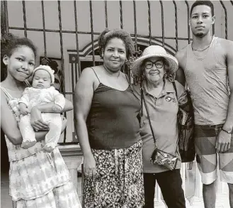  ?? Courtesy of Diana Doria ?? Peace Corps volunteer Diana Doria, second from right, stands with the Brios family, her hosts in Sabana al Medio, Dominican Republic. Doria was among volunteers evacuated from posts in 60 nations.