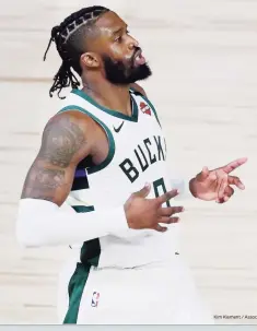  ?? Kim Klement / Associated Press ?? Above, Milwaukee Bucks guard Wesley Matthews reacts after making a 3-point basket on Aug. 18. At top, his father, Greenwich Academy basketball coach Wes Matthews Sr. in 2017.