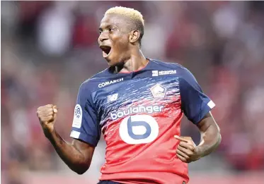  ??  ?? Super Eagles striker, Victor Osimhen celebrates after scoring a goal for Lille in the French league.