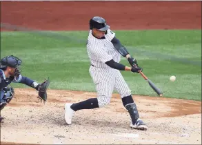  ?? Al Bello / Getty Images ?? The Yankees’ Gary Sanchez connects for a two-run home run on Thursday against the Blue Jays.