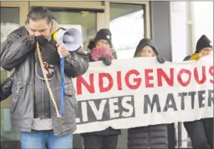  ?? CP PHOTO ?? Walter Red Thunder, left, from Red Pheasant First Nation gets emotional during a rally in Regina following the not guilty verdict in the Gerald Stanley trial.