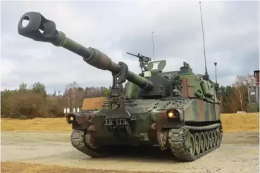  ?? CAPT. PATRICK M. CONNELLY/U.S. ARMY VIA AP ?? U.S. soldiers from Battery A, 41st Field Artillery Regiment, 1st Armored Brigade Combat Team, 3rd Infantry Division, conduct live-fire exercises March 14 using a M109 Paladin at the Grafenwoeh­r Training Area in Germany.