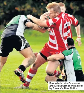  ??  ?? Pontyates’s Luke Emmanuel and Alex Rowlands end a break by Furnace’s Rhys Phillips.