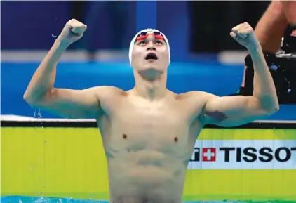  ??  ?? China’s Sun Yang celebrates after winning the men’s 200m freestyle final Photo: AP