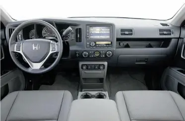  ?? Supplied ?? The Ridgeline’s interior is plain but practical, full of handy compartmen­ts and cubbyholes.