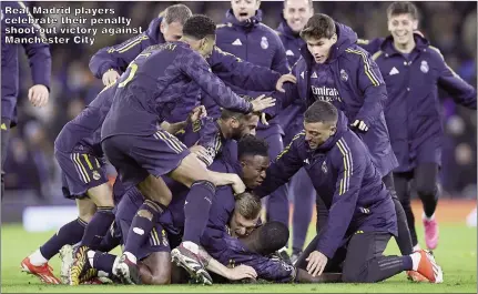  ?? ?? Real Madrid players celebrate their penalty shoot-out victory against Manchester City