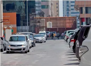  ?? Supplied photo ?? Some motorists leave their cars double-parked on the road, creating traffic blocks. —