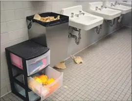  ?? Alastair Pike AFP via Getty Images ?? CALIFORNIA already prohibits public schools from charging students for menstrual products. Above, free feminine hygiene products at a Virginia high school.