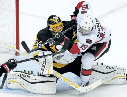  ?? THE CANADIAN PRESS FILES ?? Ottawa’s Derick Brassard collides with Pittsburgh goalie Marc-Andre Fleury for a goaltender interferen­ce penalty earlier this season.