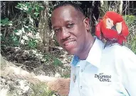  ??  ?? Sales and marketing manager Paul Norman along with one of the resident parrots at Dolphin Cove Ocho Rios.