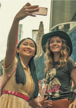  ?? PROVIDED BY SARAH SHATZ/NETFLIX ?? Lara Jean (Lana Condor, left) and her best friend Christine (Madeleine Arthur) check out the sights in New York City during their senior trip in “To All the Boys: Always and Forever.”