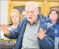  ?? KATHY JOHNSON ?? Shelburne town CAO Dylan Heide makes a point during the policing services public informatio­n and input session at the Shelburne Community Centre on Feb. 20. In the background is acting chief for Bridgewate­r Police Services, Scott Feener.