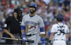  ?? CARLOS OSORIO/THE ASSOCIATED PRESS ?? Blue Jay Jose Bautista heads for the dugout after striking out in the sixth inning of Saturday night’s game at Comerica Park. Bautista went 0 for 2.