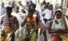  ?? Photograph: Sia Kambou/AFP/Getty ?? Flora Doume (centre), a young woman with noma disease, waits at the Rochelle clinic in Abidjan, Ivory Coast, before undergoing reconstruc­tive surgery.