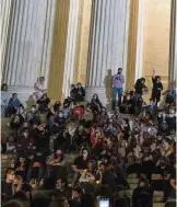  ??  ?? Mourners gather outside the Supreme Court building in Washington, D.C., on Friday following the announceme­nt of Ruth Bader Ginsburg’s death.