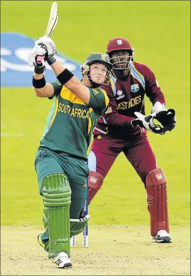 ?? Picture: REUTERS ?? MR DEPENDABLE: South Africa's Colin Ingram hits a six as West Indies' Johnson Charles looks on during the ICC Champions Trophy group B match in Cardiff on Friday. Ingram top scored with 73 off 63 balls to help his team to the semifinals