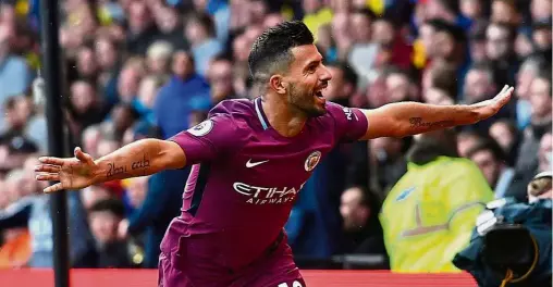  ?? — AFP ?? Surging Sergio: Sergio Aguero celebratin­g after scoring his third and Manchester City’s fifth goal in the match against Watford at Vicarage Road on Saturday.