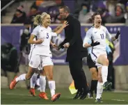  ?? Elsa / Getty Images ?? England’s Ellen White celebrates her goal that beat the United States with Steph Houghton (5).