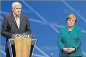  ?? AP FILE ?? Coalition dharma, German style: Merkel and Horst Seehofer