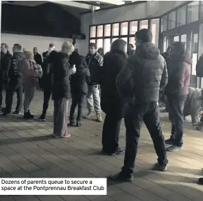  ??  ?? Dozens of parents queue to secure a space at the Pontprenna­u Breakfast Club
