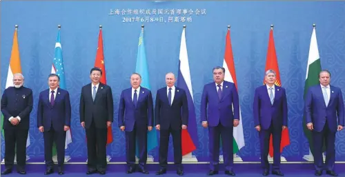  ?? MA ZHANCHENG / XINHUA ?? President Xi Jinping joins leaders for a group photo on Friday at the summit of the Shanghai Cooperatio­n Organizati­on in Astana, Kazakhstan. They are, from left, Indian Prime Minister Narendra Modi, Uzbekistan­i President Shavkat Mirziyoyev, President...