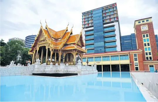  ??  ?? A classical-style pavilion in front of Siriraj Bimuksthan Museum houses the statue of King Rama V and one of his sons, Prince Mahidol Adulyadej, who was named the Father of Modern Medicine and Public Health after his devotion to develop modern medical...