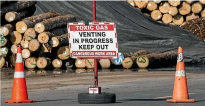  ?? STUFF ?? A methyl bromide fumigation in progress at the Port of Tauranga. The ozonedeple­ting toxic gas is harmful to humans and banned in many countries, but in New Zealand it is being used more than ever before.