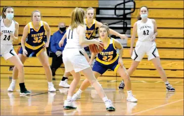  ?? PILOT PHOTO/RON HARAMIA ?? Triton’s Lexi Hostrawser (32), Abbey Viers (24) and Emma Hepler (22) take their defensive positions during a game earlier this season. The Lady Trojans are in action Saturday night at home.