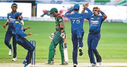  ?? Virendra Saklani/Gulf News ?? Sri Lanka’s Lasith Malinga celebrates a wicket at the Dubai Internatio­nal Stadium yesterday. The pacer claimed four wickets.