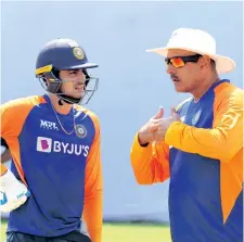  ??  ?? India opener Shubman Gill (left) listens to head coach Ravi Shastri