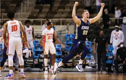  ??  ?? Oral Roberts forward Francis Lacis celebrates after the Golden Eagles’ upset of Florida on Sunday to reach the Sweet 16 of the NCAA tournament. Photograph: Trevor Brown Jr/NCAA Photos/Getty Images