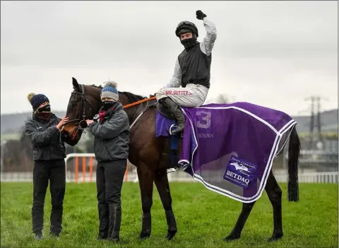  ??  ?? Jockey Jonathan Moore celebrates after riding Flooring Porter to victory on day three of the Leopardsto­wn Christmas Festival.