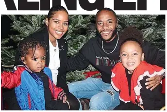  ??  ?? Happy families: Sterling in a Christmas image he posted on Instagram