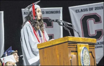  ?? Chase Stevens Las Vegas Review-Journal @csstevensp­hoto ?? Coronado High School valedictor­ian Olivia Yamamoto speaks during its graduation ceremony May 25 at the Thomas & Mack Center.