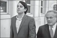  ?? AP/SETH WENIG ?? Former Turing Pharmaceut­icals CEO Martin Shkreli (left) arrives at federal court in New York on Monday with his attorney, Benjamin Brafman, for the opening day of his securities fraud trial.