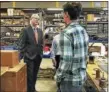  ?? JACK KRAMER — CTNEWSJUNK­IE ?? Kevin Lembo, left, talks to workers at Precision Combustion Thursday.