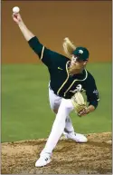  ?? EZRA SHAW — GETTY IMAGES ?? The Athletics’ Jordan Weems has made a tough transition from catcher to hardthrowi­ng relief pitcher.