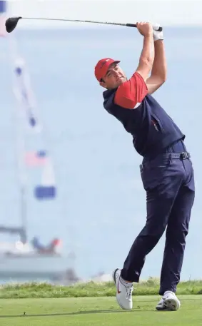  ?? GARY C. KLEIN/SHEBOYGAN PRESS ?? Team USA’s Scott Scheffler tees off on the ninth hole during the Ryder Cup on Sunday at Whistling Straits.