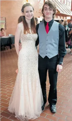  ??  ?? Victoria Skorobohac­h, left, and Aric Froese bring a touch of red-carpet glamour to the Cappies Gala.