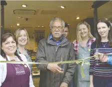  ?? Pictures: Phil Creighton ?? Members of CLASP and Cook came together on Friday to watch Joseph Davidson cut the ribbon to declare the new Peach Place store open