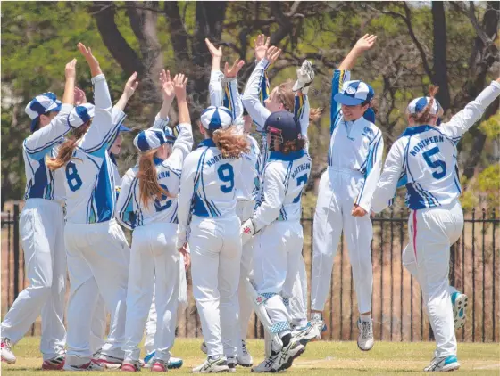  ??  ?? The North Queensland girls’ schools side celebrate after taking a wicket at the state championsh­ips in Bundaberg. BELOW: Karina Guglieimi was chosen in the state merit squad. q ad. Pictures: DAMIEN HORNE