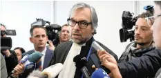  ?? | Reuters ?? PETER Langstraat, a lawyer representi­ng victims’ families, talks to the media after a Dutch court opened the criminal trial against four suspects in the 2014 downing of Malaysia Airlines flight MH17, in Badhoevedo­rp, Netherland­s, yesterday.