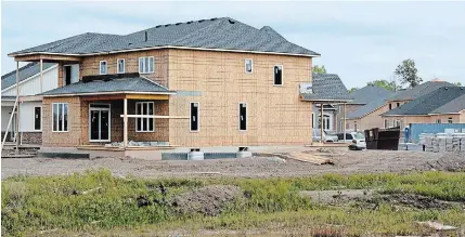  ?? TORSTAR FILE PHOTO ?? Homes under constructi­on at High Point Meadows on Green Acres Drive. While fewer building permits were issued by Fort Erie in 2020 from 2019, their overall value increased significan­tly.