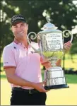  ?? AFP ?? Justin Thomas poses with the Wanamaker Trophy after winning the PGA Championsh­ip on Sunday.