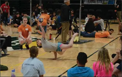  ?? Photo by Logan Hebel ?? FOCUS— Alohna Johnson competes in the One-Hand Reach at last week’s NYO Games in Anchorage.