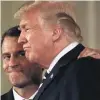  ?? PHOTO: REUTERS ?? French President Emmanuel Macron pats US President Donald Trump on the shoulder at a news conference at the White House in Washington last week.