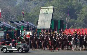  ??  ?? General Bipin Rawat reviewing the Army Day parade in New Delhi on January 15, 2017